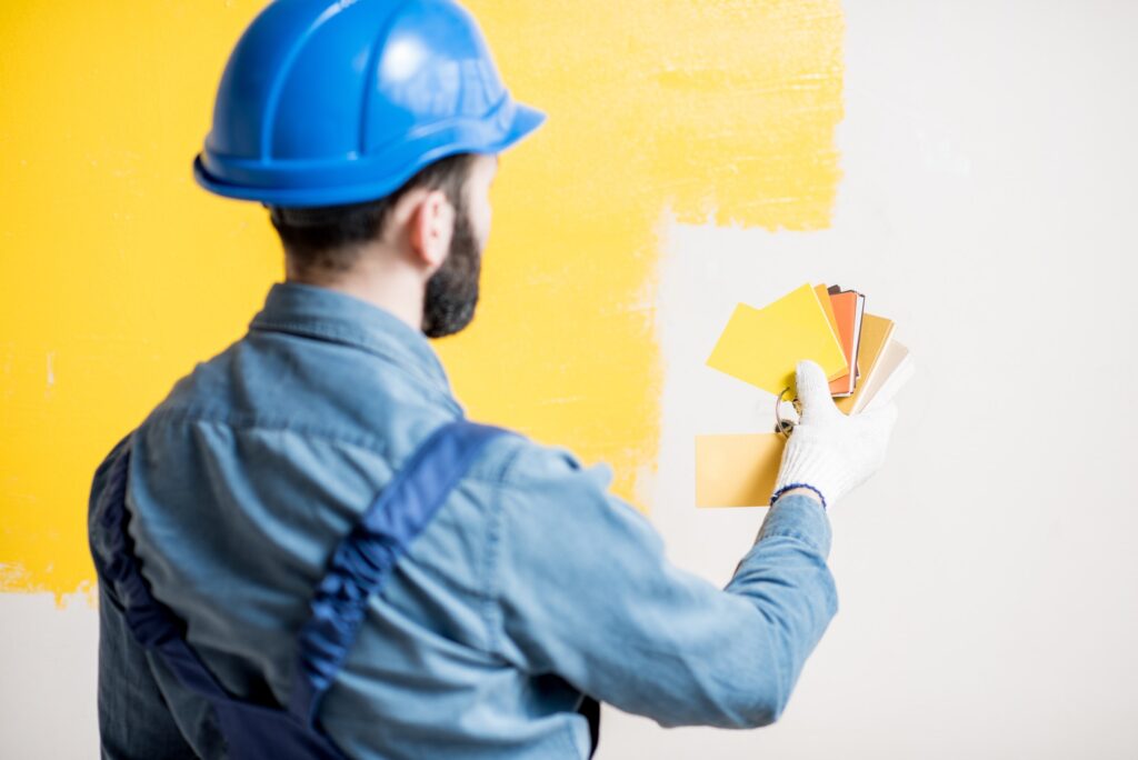 Painter comparing colors professional decorators near me painters and decorators in Barking - painting services near me